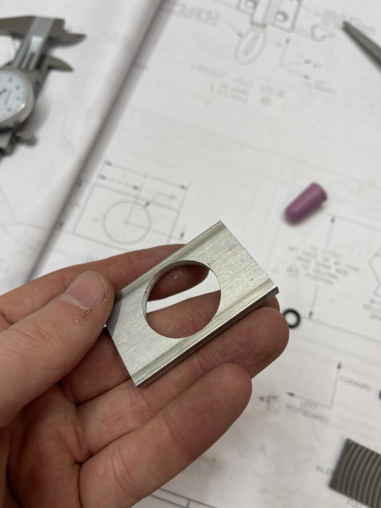 square metal piece with hole