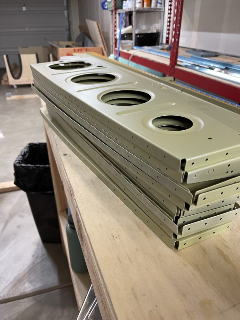 stack of primed wing ribs