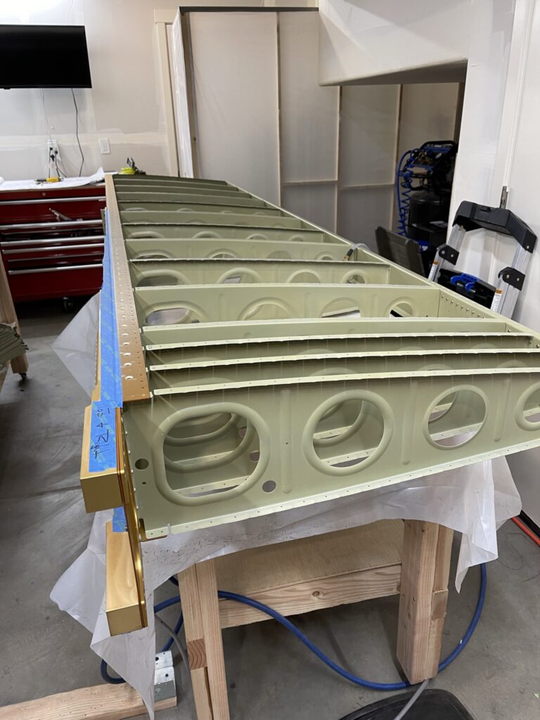 Skeleton of airplane wing with green primer