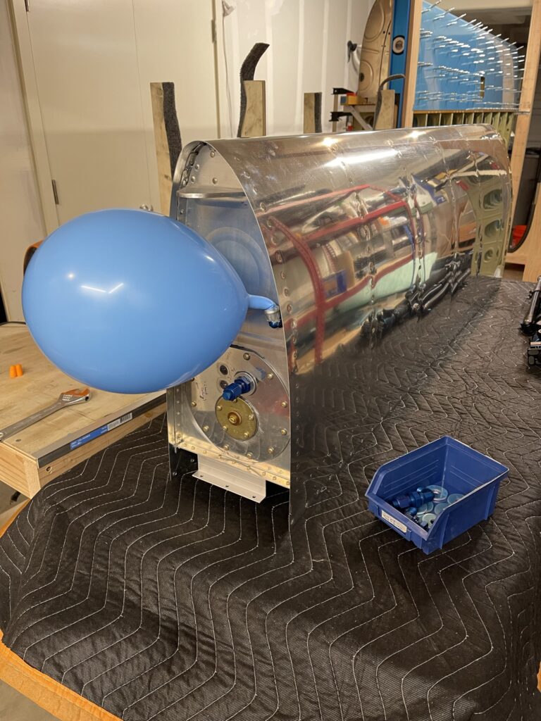 Balloon attached to airplane fuel tank